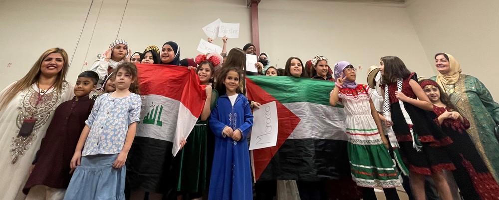 Large group of students and teachers in cultural wear
